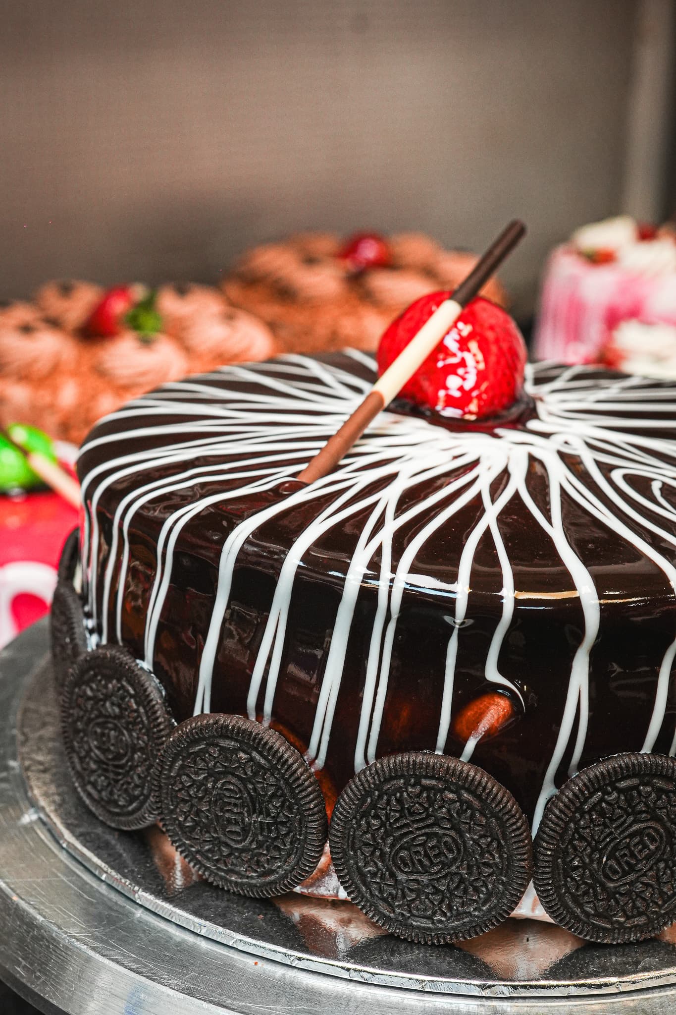 Chocolate cake with Oreo cookies and white chocolate drizzle